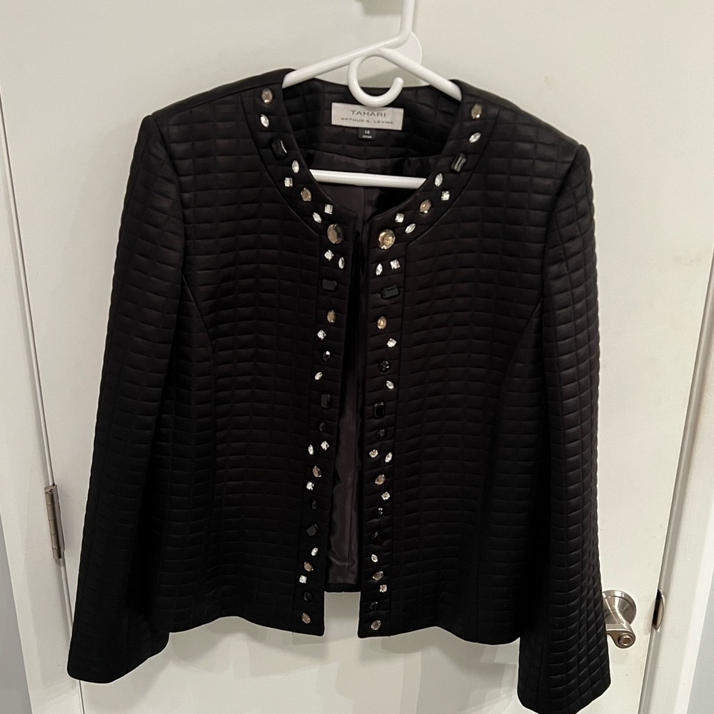 Tahari women’s black quilted evening jacket with rhinestone detail trim.